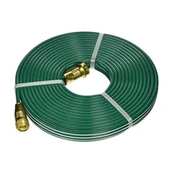 A coiled green garden hose with brass fittings.