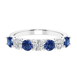 A ring with alternating blue sapphire and white diamond stones, set in a sleek metal band.