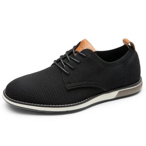 A black lace-up casual shoe with a knit texture, featuring a tan leather accent at the tongue and heel. The sole is white with a brown section, providing a modern, versatile look.