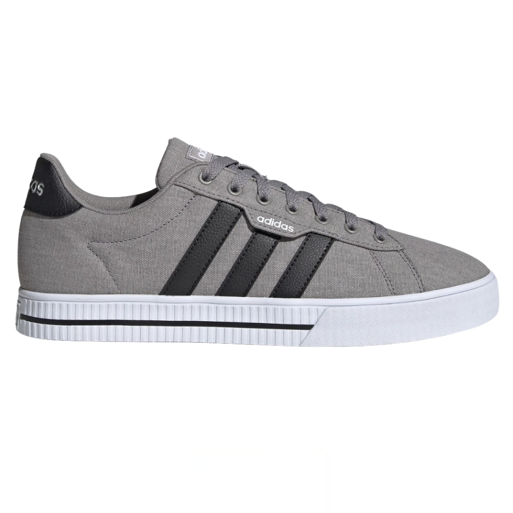 Gray Adidas sneaker with black stripes, canvas upper, and white rubber sole.
