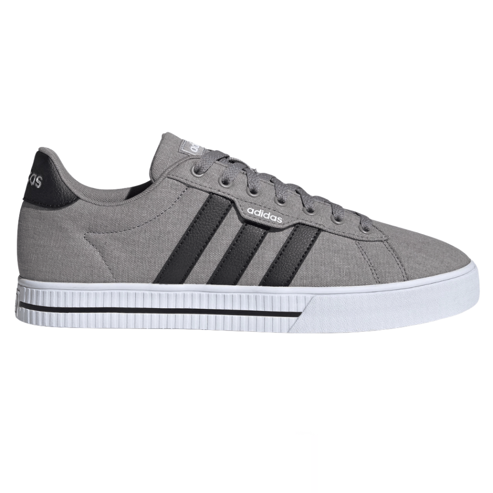 Gray Adidas sneaker with black stripes, canvas upper, and white rubber sole.