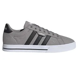 Gray Adidas sneaker with black stripes, canvas upper, and white rubber sole.