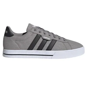 Gray Adidas sneaker with black stripes, canvas upper, and white rubber sole.