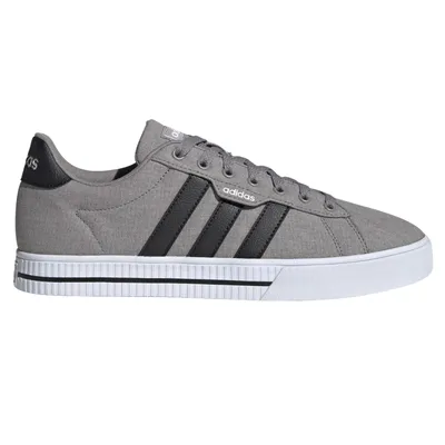 Gray Adidas sneaker with black stripes, canvas upper, and white rubber sole.