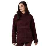 A woman is wearing a burgundy, plush sherpa hoodie with a front kangaroo pocket and relaxed fit.