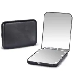 A compact black handheld mirror with LED lights, featuring a folding design for portability.