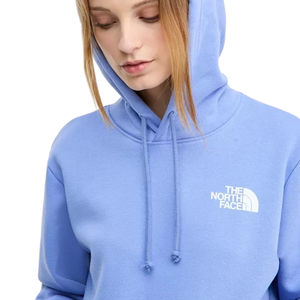 A person is wearing a blue The North Face hoodie with a white logo on the chest. The hoodie has a drawstring hood.