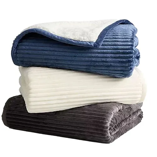 A stack of folded, ribbed fleece blankets in blue, cream, and gray colors, showcasing their plush texture and cozy design.