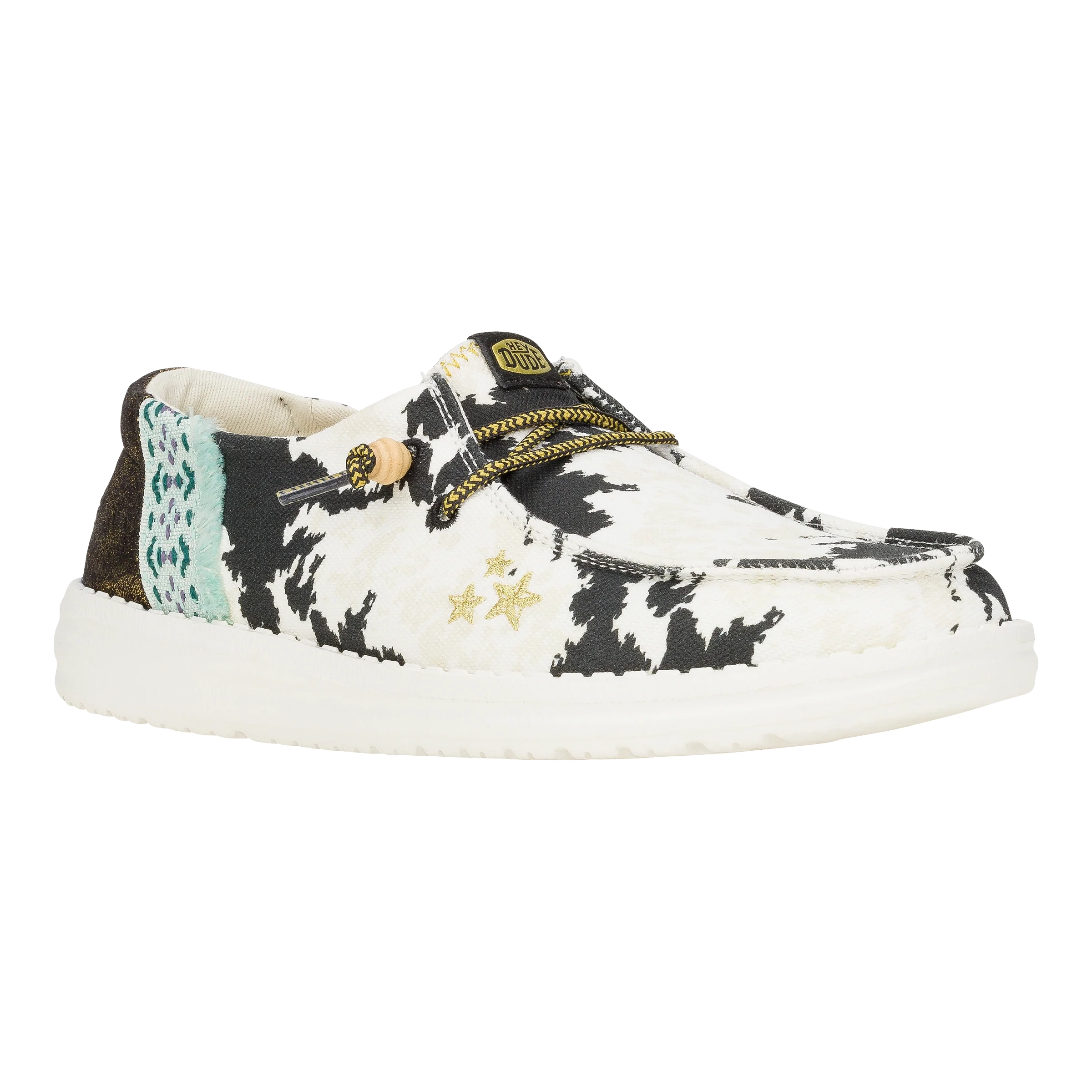 Hey Dude Wendy Disco Cow Shoes feature a black and white cow print design with a touch of turquoise and gold star accents. They have a comfortable slip-on style with a lightweight, cushioned sole.
