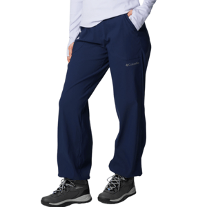 Navy blue Columbia pants with large front pockets and gray hiking boots with black and white laces.