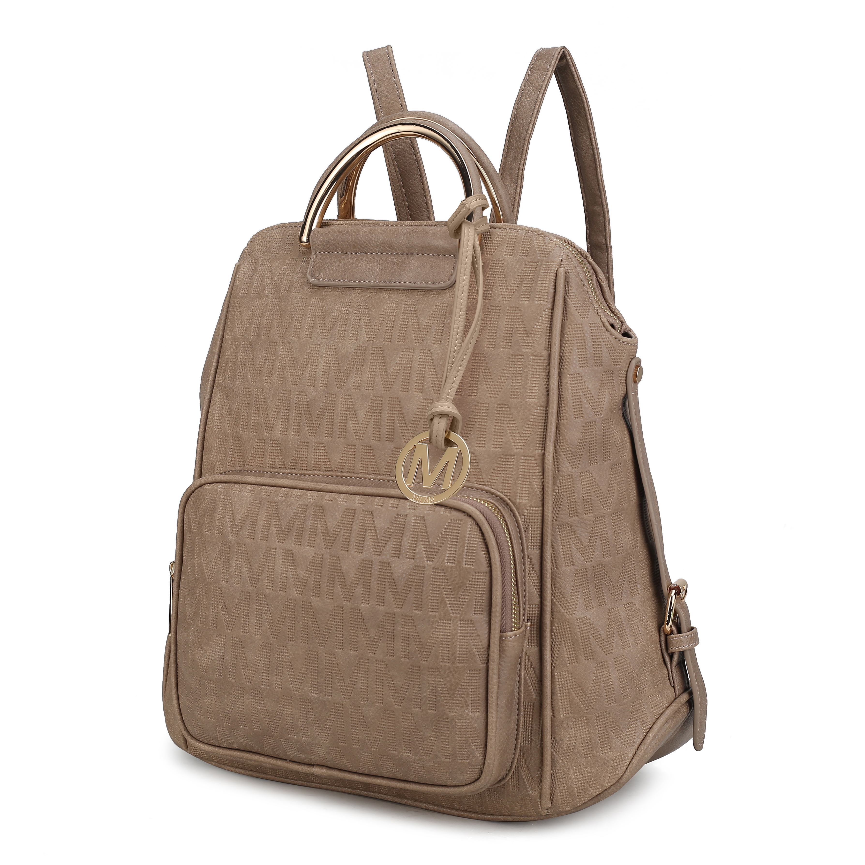 Beige backpack featuring a textured pattern with repeated \“M\“ design, adjustable straps, a front zip pocket, and a decorative circular \“M\“ charm.