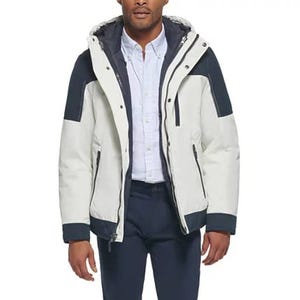 A men's 3-in-1 jacket featuring a white and black design with a detachable hood, zipper, and snap closures. It includes side pockets and insulated inner lining, suitable for versatile weather conditions.