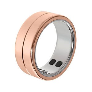 The YoR by Letsfit Smart Ring features a sleek design with a rose gold exterior and silver inner band, incorporating two black sensor contact points.