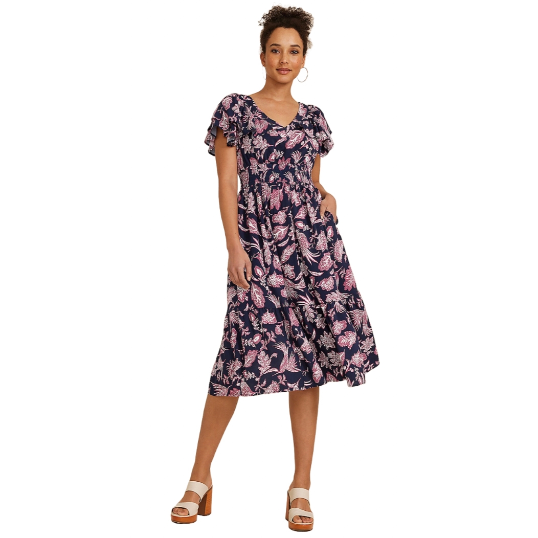 Navy blue floral midi dress with pink and white floral patterns, featuring flutter sleeves, a V-neckline, and side pockets. The dress is paired with tan platform sandals.