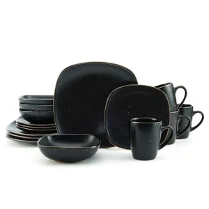 A black speckled dinnerware set featuring square plates, bowls, and mugs. The set includes multiple pieces stacked together, showcasing a modern, minimalist design.
