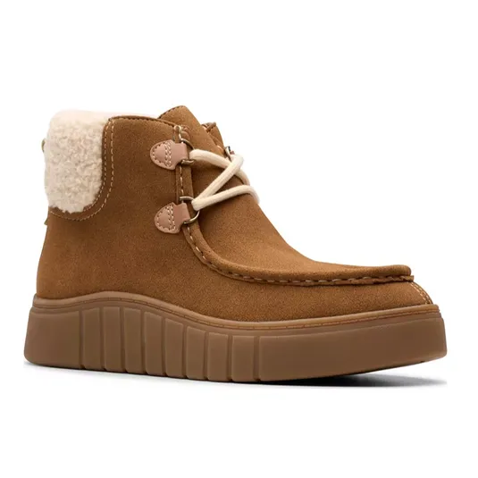 Brown suede ankle boot with a shearling lining, lace-up front, and ribbed platform sole.