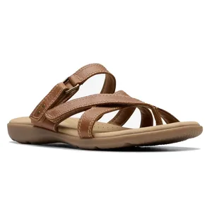 Brown strappy sandal with adjustable buckle, cushioned insole, and textured sole.