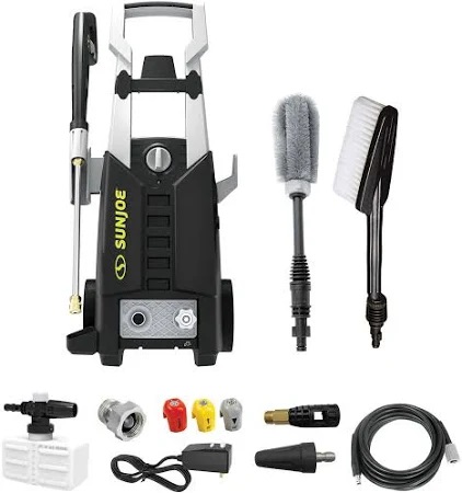 A pressure washer with accessories including nozzles, brushes, a hose, and a gun.