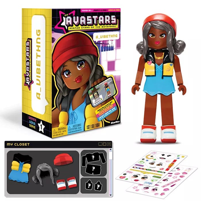 A LUVABELLA doll with interchangeable clothes, a beanie, two shoes, and a sticker sheet.