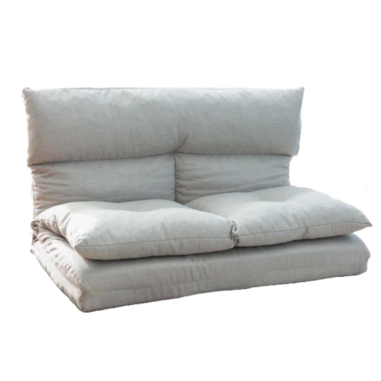 An adjustable flip floor sofa with plush cushions and a soft, neutral fabric. It can be configured for seating or lounging, offering versatility for different comfort needs.