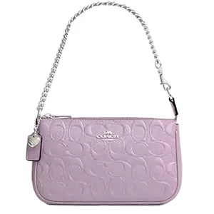 A light purple Coach handbag with an embossed logo pattern, featuring a silver chain strap and a small attached tag.