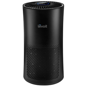 A black Levoit air purifier with a cylindrical design, featuring a top control panel and a perforated lower section for air intake.
