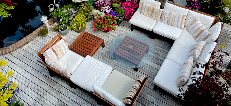 Outdoor patio furniture collection with table, chairs, and umbrella in modern design