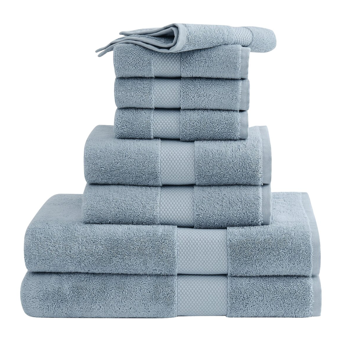 A stack of light blue towels is neatly arranged, featuring various sizes, including washcloths, hand towels, and bath towels.