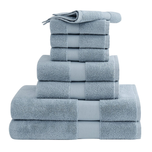 A stack of light blue towels is neatly arranged, featuring various sizes, including washcloths, hand towels, and bath towels.