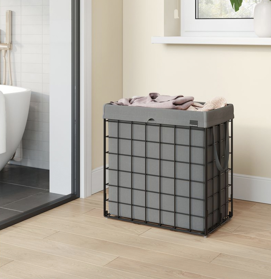 A grey, square laundry hamper with a lid, constructed with metal wire sides and fabric liner.