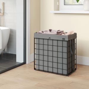 A grey, square laundry hamper with a lid, constructed with metal wire sides and fabric liner.