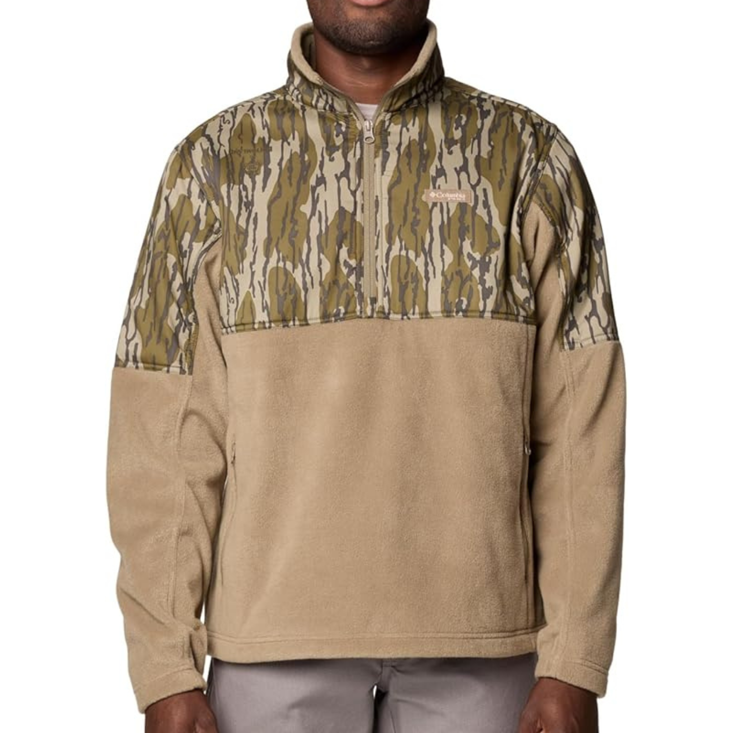 Columbia camo fleece pullover with a tan body and camouflage pattern on the upper chest and sleeves. Features a quarter-zip collar and side pockets for a casual outdoor look.