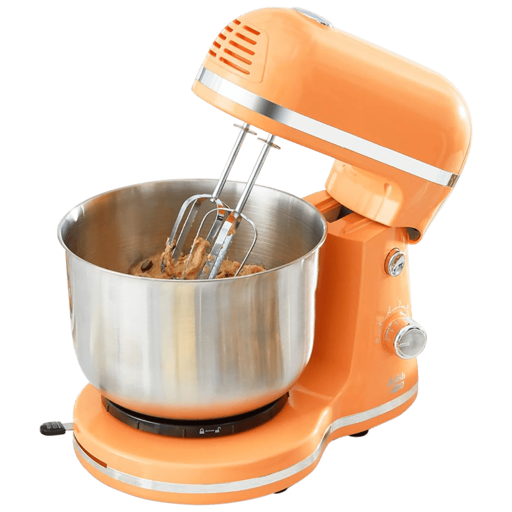 An orange stand mixer with a stainless steel bowl and twin beaters, ready for baking tasks.