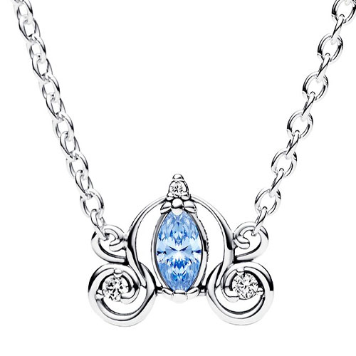 A necklace with a silver chain features an ornate pendant resembling a carriage, with a central marquise-cut light blue gemstone and small accent stones.