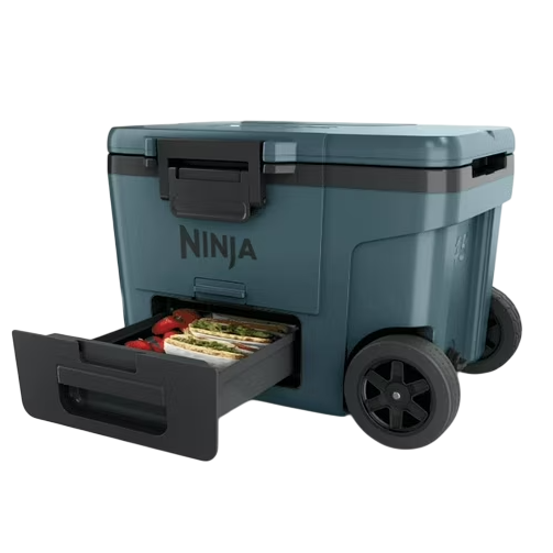 A wheeled cooler with a pull-out drawer labeled \“Ninja,\“ designed for portable food and drink storage.