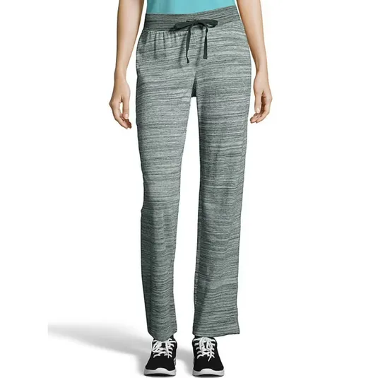 Gray drawstring lounge pants with a heathered texture, paired with black sneakers.