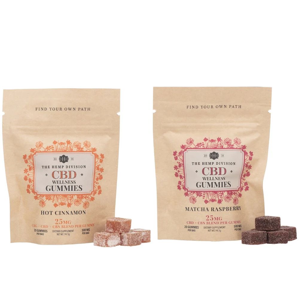 Two packages of The Hemp Division CBD Wellness Gummies in Hot Cinnamon and Matcha Raspberry flavors, each containing 25mg of CBD per gummy, with 20 gummies per bag.