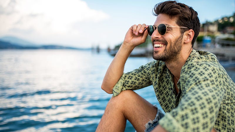 man wearing printed shirt and sunglasses