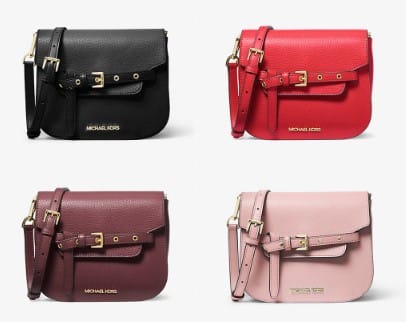 Four crossbody bags by Michael Kors in black, red, burgundy, and pink, each featuring a buckle detail and a shoulder strap.