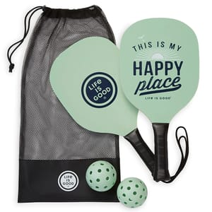 Pickleball set with two mint green paddles and two perforated balls, featuring \“Life is Good\“ branding and a mesh carrying bag.