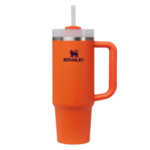 An orange Stanley insulated tumbler with a handle, lid, and straw.
