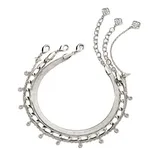 A silver necklace featuring multiple chain styles, including snake, curb, and cable chains, is adorned with small circular charms and delicate links terminating in geometric motifs.