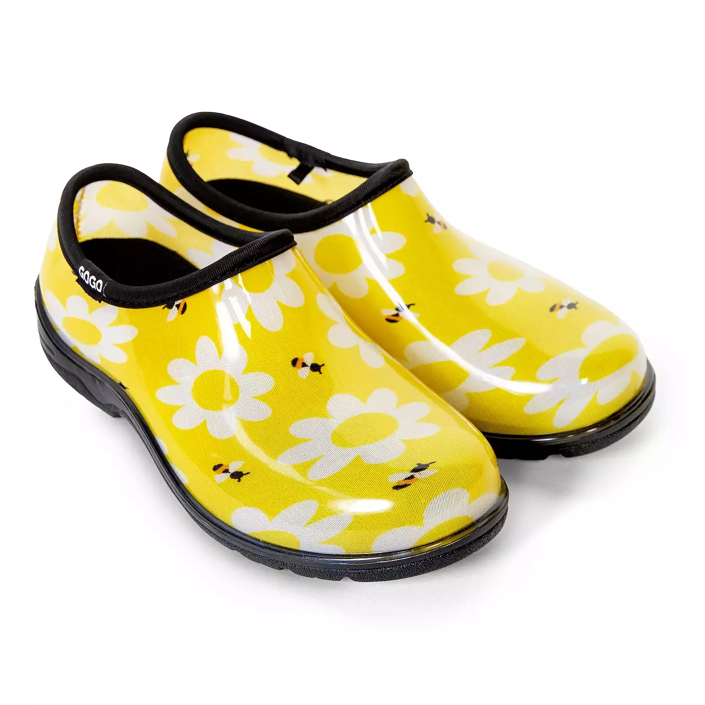 Yellow garden clogs with black trim, featuring a pattern of white daisies and small bees. They have a slip-on design and black soles.