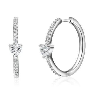 A pair of silver hoop earrings adorned with small sparkling stones and a central heart-shaped gem.