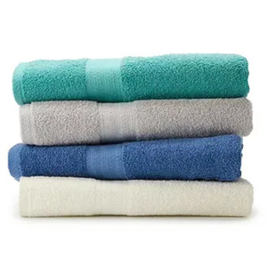 Four stacked bath towels in turquoise, gray, blue, and white.