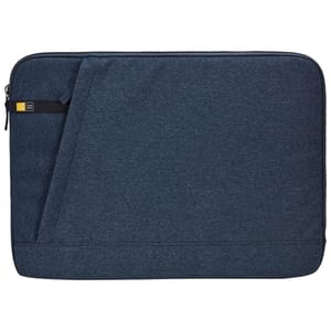 A navy blue 15.6\“ laptop sleeve featuring a minimalist design with a zipper closure and diagonal front seam. It includes a small fabric looped strap and a discreet branded tag.
