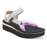 Colorful platform sandal with adjustable straps in light blue, pink, and beige on a black sole.