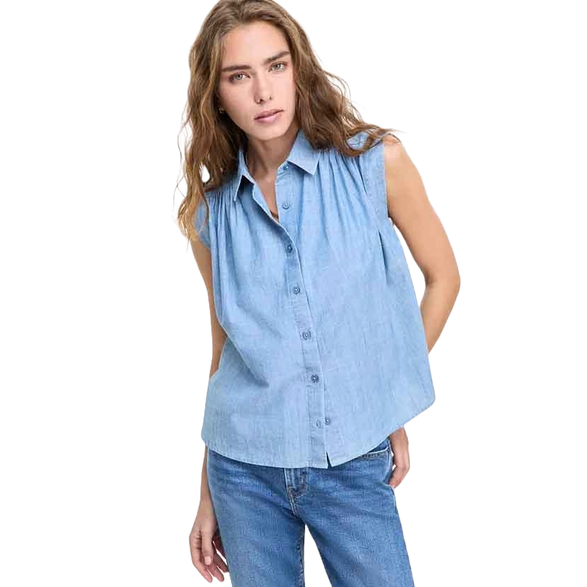 Sleeveless light blue button-down shirt from Levi's, made from cotton, featuring a relaxed fit and subtle pleats near the shoulders for added style. Paired with blue jeans.