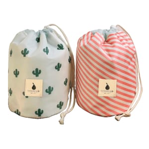 Two drawstring bags, one with a cactus print on a white background and the other with diagonal pink and white stripes, both featuring a square logo patch.
