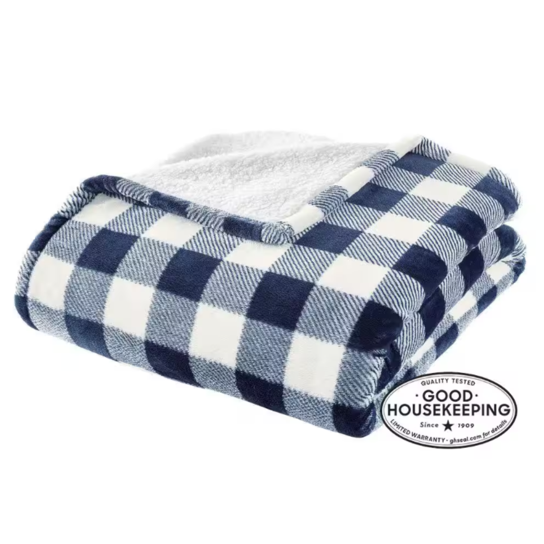 A folded blue and white checkered blanket with a plush white underside.